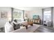 Inviting living room with comfortable seating, ample natural light, and contemporary decor touches at 5451 Baybrook Cir, South Fulton, GA 30349