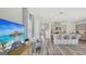 Stylish living space featuring a cozy seating area, modern decor, and a view into the adjacent kitchen at 5451 Baybrook Cir, South Fulton, GA 30349