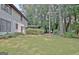 Backyard featuring lush green space and a home exterior at 212 Garret Rdg, Peachtree City, GA 30269