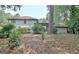 Backyard with a large house and lush trees at 212 Garret Rdg, Peachtree City, GA 30269