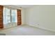 Bright bedroom featuring a large window with charming floral curtains at 212 Garret Rdg, Peachtree City, GA 30269