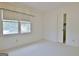 Well-lit bedroom showcasing windows, white carpet and closet at 212 Garret Rdg, Peachtree City, GA 30269