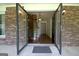 Open foyer featuring glass front doors, a staircase, and wood flooring at 212 Garret Rdg, Peachtree City, GA 30269