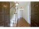 Foyer with wood floors, a staircase, and decorative light fixtures at 212 Garret Rdg, Peachtree City, GA 30269