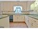 A kitchen featuring white cabinetry, green countertops, and stainless-steel appliances at 212 Garret Rdg, Peachtree City, GA 30269