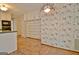 A kitchen featuring white cabinetry, green countertops, and tile floors at 212 Garret Rdg, Peachtree City, GA 30269