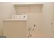 Laundry room with a white washing machine, shelf, and connections at 212 Garret Rdg, Peachtree City, GA 30269