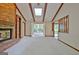 Bright living room with a fireplace, skylight and access to sunroom at 212 Garret Rdg, Peachtree City, GA 30269