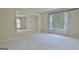 Large living room bathed in natural light with neutral carpet flooring at 212 Garret Rdg, Peachtree City, GA 30269