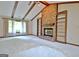 An open living room showcasing a brick fireplace flanked by built-in bookcases at 212 Garret Rdg, Peachtree City, GA 30269