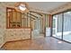 A living room with an old brick fireplace and a vaulted ceiling with exposed beams at 212 Garret Rdg, Peachtree City, GA 30269