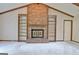 Spacious living room featuring a brick fireplace with built-in shelving at 212 Garret Rdg, Peachtree City, GA 30269