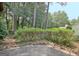 Patio with lush landscaping, ideal for outdoor dining and entertainment in a private setting at 212 Garret Rdg, Peachtree City, GA 30269