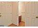 Compact powder room with traditional fixtures adjacent to exterior door at 212 Garret Rdg, Peachtree City, GA 30269