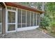 Enclosed screened porch with a ceiling fan and tiled flooring, perfect for enjoying the outdoors comfortably at 212 Garret Rdg, Peachtree City, GA 30269
