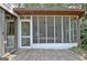 Inviting screened-in porch with a ceiling fan, providing an excellent space for relaxing outdoors at 212 Garret Rdg, Peachtree City, GA 30269