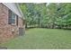 Home exterior showing side yard and air conditioning unit at 501 Bridlepath Ln, Peachtree City, GA 30269