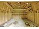 Barn interior with exposed wooden framing, providing a rustic, unfinished storage space at 501 Bridlepath Ln, Peachtree City, GA 30269