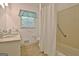 Bathroom features a toilet, vanity and sink with natural light at 501 Bridlepath Ln, Peachtree City, GA 30269