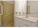 Neutral bathroom features a shower and white vanity sink with ample storage at 501 Bridlepath Ln, Peachtree City, GA 30269