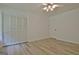Bright bedroom with ample closet space and light laminate flooring at 501 Bridlepath Ln, Peachtree City, GA 30269