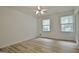 Bedroom features hardwood floors, closet, windows and a fan at 501 Bridlepath Ln, Peachtree City, GA 30269