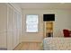 Bedroom features a closet, a window and natural light at 501 Bridlepath Ln, Peachtree City, GA 30269
