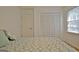 Bedroom features a closet, a window and natural light at 501 Bridlepath Ln, Peachtree City, GA 30269