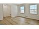 Bedroom with natural light, wood-look floors, and neutral walls at 501 Bridlepath Ln, Peachtree City, GA 30269