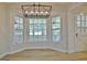 Sun-filled dining nook featuring a three-part bay window and modern lighting fixture at 501 Bridlepath Ln, Peachtree City, GA 30269