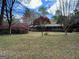 Charming single-story home with brick facade and landscaped front yard, enhancing curb appeal at 501 Bridlepath Ln, Peachtree City, GA 30269