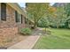 Brick home with landscaped walkway leading to the front entrance and side yard at 501 Bridlepath Ln, Peachtree City, GA 30269