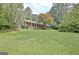 Well-maintained brick home with a sprawling green lawn and mature landscaping at 501 Bridlepath Ln, Peachtree City, GA 30269