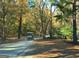 Enjoy a leisurely ride in your golf cart through wooded roads on this community's beautiful wooded trails at 501 Bridlepath Ln, Peachtree City, GA 30269