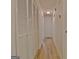 Hallway features hardwood floors, built-in closet, and lighting at 501 Bridlepath Ln, Peachtree City, GA 30269