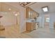 Eat-in kitchen featuring oak cabinets, white appliances, and an open view to the living room at 501 Bridlepath Ln, Peachtree City, GA 30269