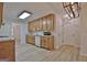 Spacious kitchen with oak cabinets, modern vinyl flooring and stainless steel appliances at 501 Bridlepath Ln, Peachtree City, GA 30269