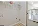 Bright laundry room with access to a screened in porch at 501 Bridlepath Ln, Peachtree City, GA 30269