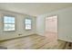 Bright living room boasting large windows, light-colored walls, and modern flooring at 501 Bridlepath Ln, Peachtree City, GA 30269