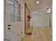 Cozy living room entrance with brick fireplace and hardwood flooring at 501 Bridlepath Ln, Peachtree City, GA 30269