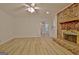 Bright living room features a brick fireplace, new floors, and access to the sunroom at 501 Bridlepath Ln, Peachtree City, GA 30269