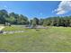 Enjoy the community playground with a slide, and ample seating amidst the serene landscape at 501 Bridlepath Ln, Peachtree City, GA 30269