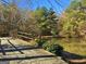 Charming bridge over the tranquil pond, perfect for enjoying the serene natural scenery at 501 Bridlepath Ln, Peachtree City, GA 30269