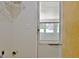 View from a bright laundry room to the screen porch at 501 Bridlepath Ln, Peachtree City, GA 30269