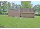 Exterior view of a shed with ample storage space, perfect for tools or equipment at 501 Bridlepath Ln, Peachtree City, GA 30269