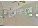 Large sunroom featuring a row of windows offering great light and backyard views at 501 Bridlepath Ln, Peachtree City, GA 30269