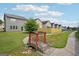 Neighborhood backyard with wood fence, small bridge, green grass and mature trees at 2493 Oakleaf Rdg, Lithonia, GA 30058