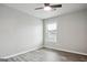 Neutral bedroom with ceiling fan, gray walls, and wood-look flooring at 2493 Oakleaf Rdg, Lithonia, GA 30058