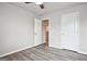 Bedroom with doors and wood-look flooring and light gray walls at 2493 Oakleaf Rdg, Lithonia, GA 30058