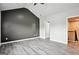 Large bedroom features hardwood floors, neutral walls, and a doorway leading to the hallway at 2493 Oakleaf Rdg, Lithonia, GA 30058